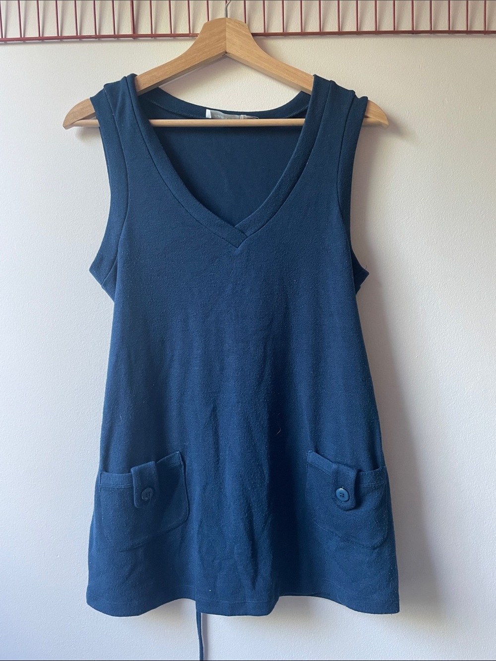 Blue knitted vest with tie